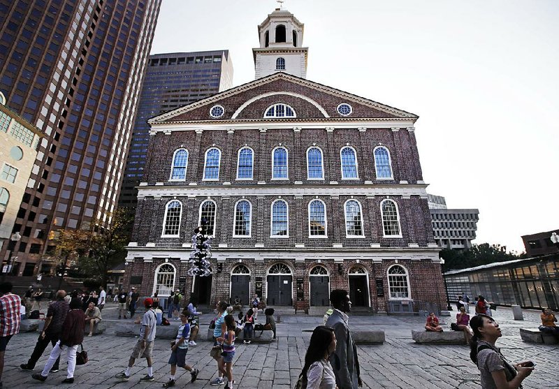 An advocacy group wants to change the name of Faneuil Hall in Boston, saying the 1742 building was named for a wealthy merchant who owned and traded slaves.