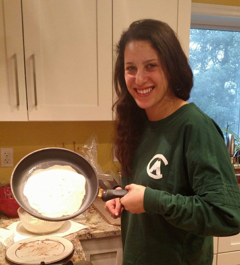 Celia, cooking crepes. 