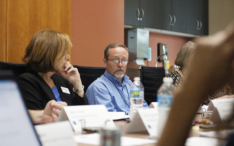 NWA Democrat-Gazette/STACY RYBURN David Johnson, Fayetteville Public Library director, speaks Tuesday to the library's board during a meeting in Fayetteville.