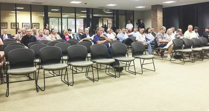 NWA Democrat-Gazette/TRACY M. NEAL Several people attended the Rogers City Council meeting Tuesday to speak about a proposed annexation of 4,000 acres east and west of Arkansas 112.