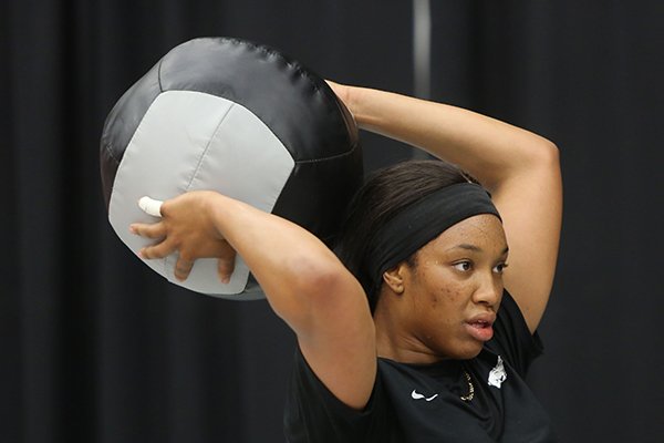 Arkansas volleyball player Elizabeth Pamphile exercises Tuesday, Aug. 22, 2017, at Barnhill Arena during practice on campus in Fayetteville.
