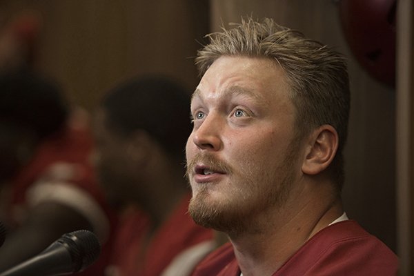 Arkansas offensive lineman Hjalte Froholdt talks to reporters during the Razorbacks' media day Saturday, Aug. 5, 2017, in Fayetteville. 