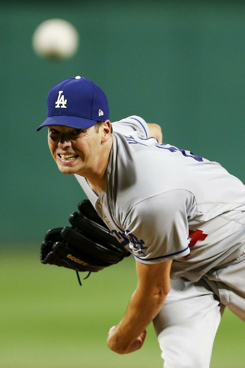 After Rich Hill (shown) had his bid for a perfect game spoiled by an error in the ninth inning, Josh Harrison opened the 10th with a home run that wrecked Hill’s improbable try at a no-hitter and lifted the Pittsburgh Pirates to a stunning 1-0 victory over the Los Angeles Dodgers. 