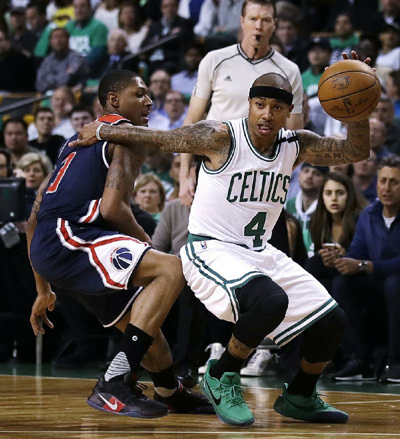 This file photo shows Boston Celtics guard Isaiah Thomas (4) driving to the basket during the first quarter of a second-round NBA playoff series basketball game in Boston.  