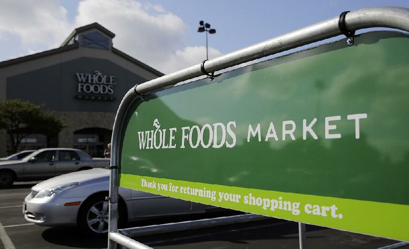 Whole Foods’ hundreds of stores, including the one shown here in San Antonio in June, will be under the umbrella of online giant Amazon after Whole Foods shareholders approved the merger.