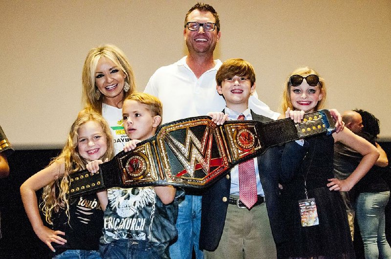 Last year’s Lip Sync Battle winner Alyson Courtney shows off the WWE championship belt prize with her fellow performers: husband Wess Moore, daughters Berkeley and Brooklyn and their helpers. The family performed to a medley of Taylor Swift songs. 