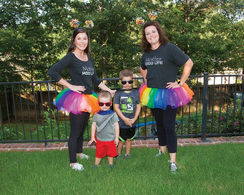 From left, Kristen Kennon, CEO of the nonprofit Playing It Back, and her sons, Slater Kennon, 2, and Steele Kennon, 5, and Laura Walker, former director of the Jacksonville Boys & Girls Club and CFO of Playing It Back, gear up for the first Tutus and Tennis Shoes set for 6 to 8 p.m. Sept. 9 at the Jacksonville Boys & Girls Club. The proceeds will benefit both the club and Playing It Back. Kennon said the event is important because there are many father-and-daughter events out there, but not for a mother and son.