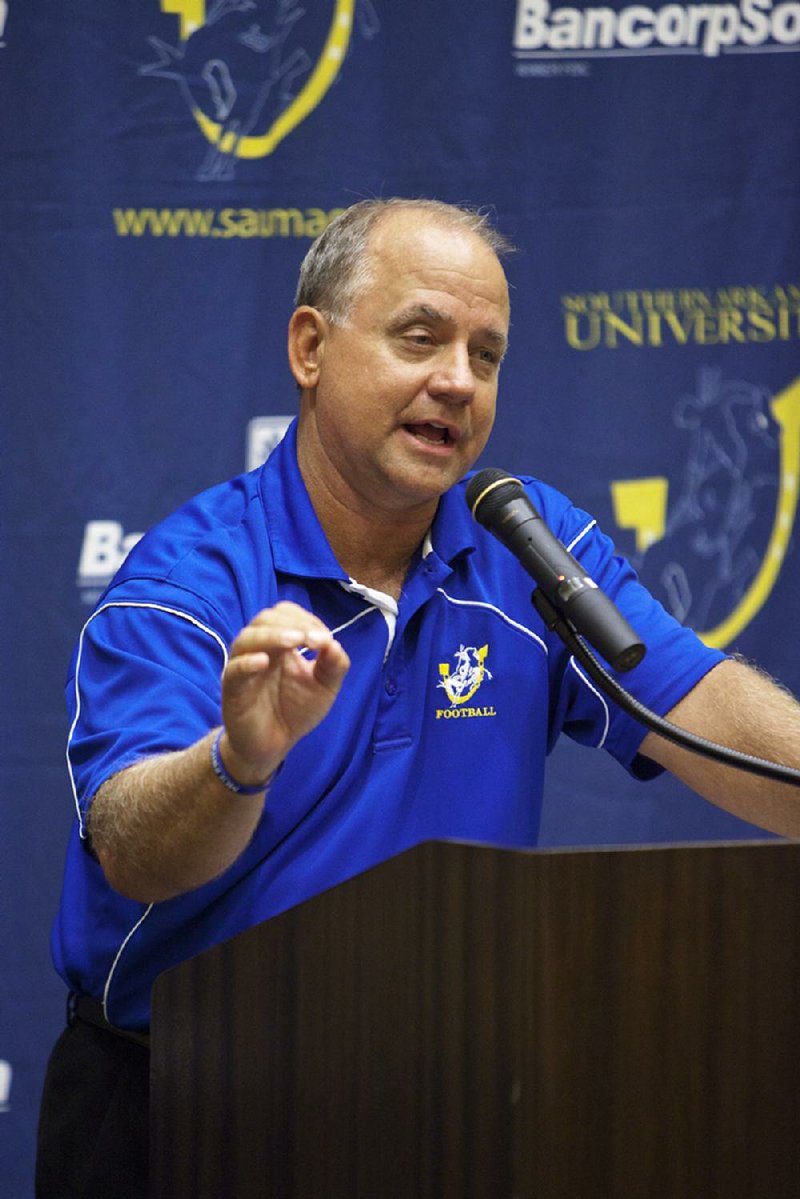 Bill Keopple, head football coach at Southern Arkansas University, speaks during a Texarkana Muleriders Club event at the Texarkana Convention Center.