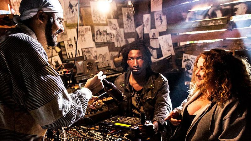 Basterd the Antichrist (Mamoudou Athie), Jeri (Siddharth Dhananjay) and Patti (Danielle Macdonald) work out their musical ideas in a scene from Patti Cake$, a movie directed by a musician who insisted on a deep authenticity.
