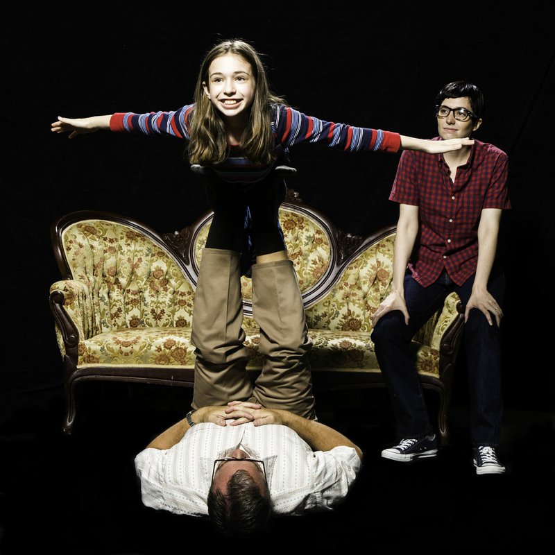 Courtesy Photo Rob Sutton (on floor), Autumn Rae Shannon and Christiana Cole star in TheatreSquared’s production of “Fun Home.” “It’s kind of easy to look at the topic and think that it’s a super-serious piece, and it is, but it’s also incredible fun and joyful and recognizable,” says director Amy Herzberg.