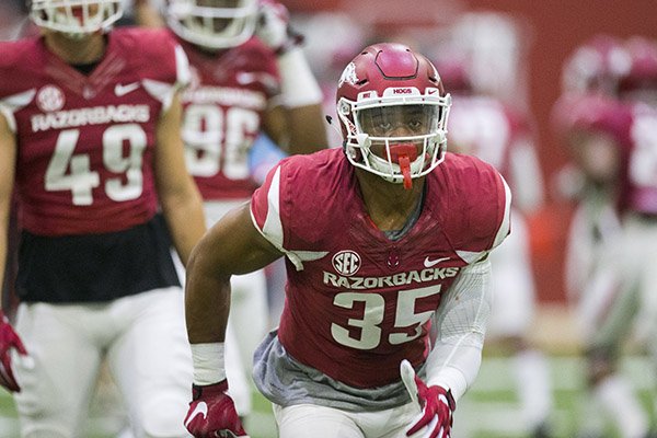 Arkansas linebacker Dwayne Eugene goes through drills during practice Saturday, April 29, 2017, in Fayetteville. 