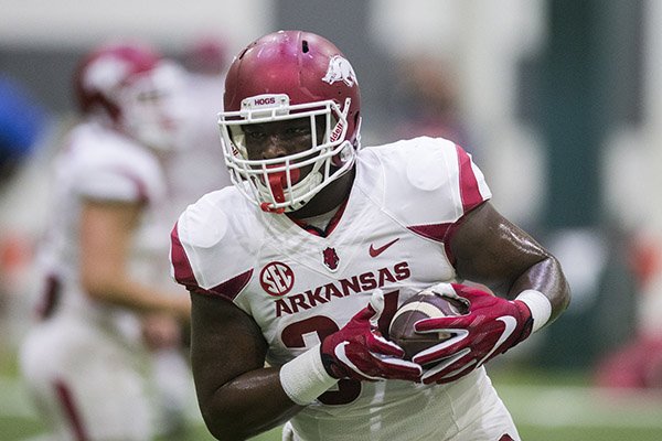 Arkansas fullback Kendrick Jackson runs with the ball during practice Saturday, April 29, 2017, in Fayetteville. 
