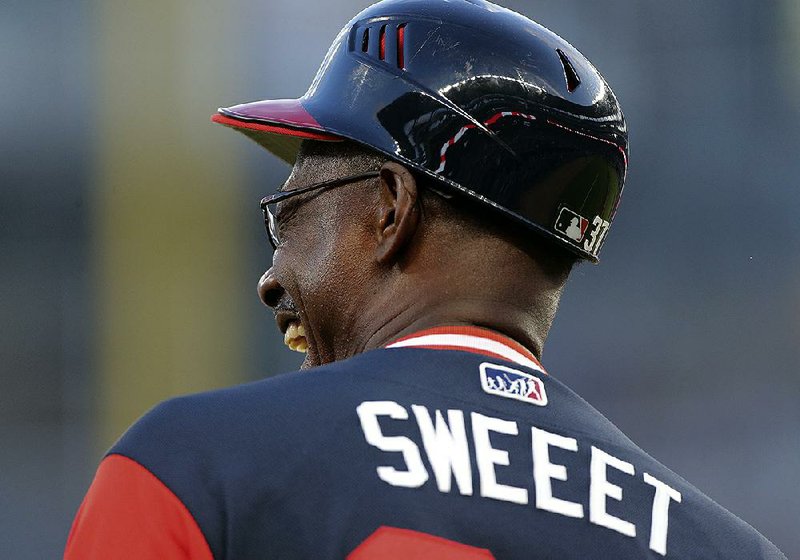 Atlanta Braves third base coach Ron Washington (37) wears a special jersey for Friday night’s game against the Colorado Rockies. Major League Baseball players and coaches are wearing special jerseys with nicknames on them this weekend.