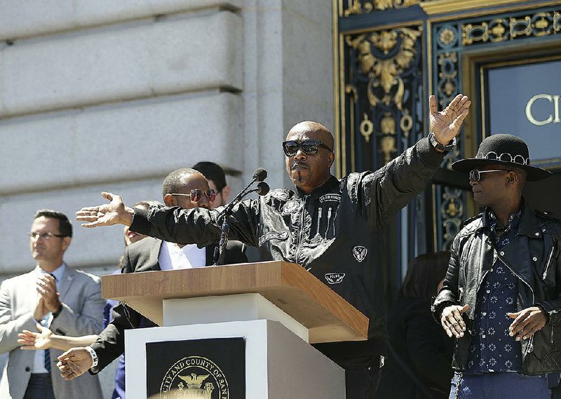 Musician MC Hammer speaks at a rally Friday in San Francisco where he said, “Hate is dangerous.”