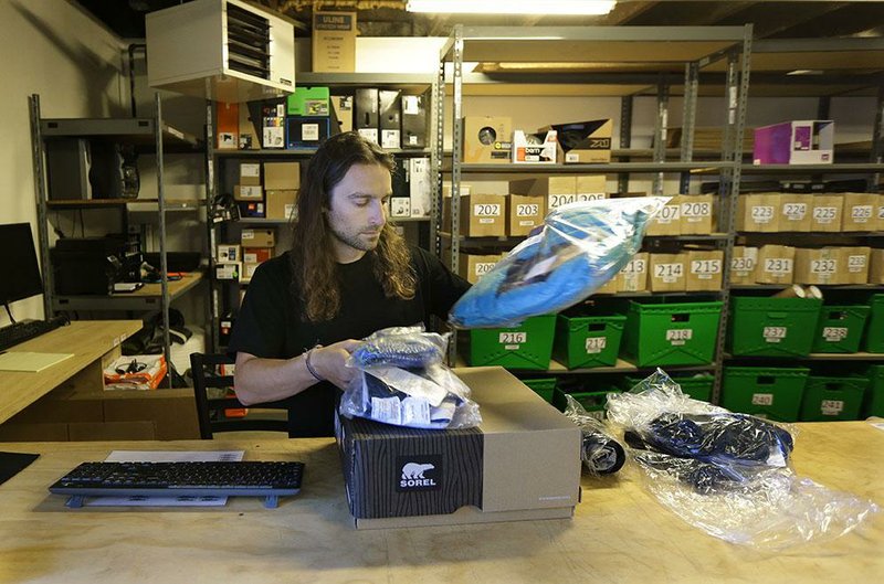 Martin Goldman processes returned items at sporting-goods retailer evo in Seattle. As a special service, evo lets customers pick up evo’s online orders at competitors’ stores. 