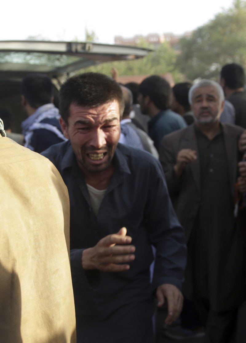 A man grieves at the scene of an attack Friday on a Shiite mosque in Kabul, Afghanistan. 