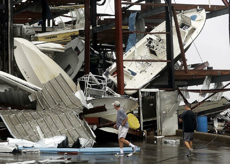 Boats tossed by Hurricane Harvey’s powerful winds and storm surge sit in a pile Saturday at a storage facility in Rockport, Texas.