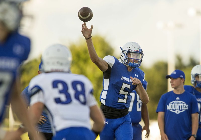NWA Democrat-Gazette/BEN GOFF @NWABENGOFF Rogers High quarterback Hunter Loyd (5) will try to lead the Mounties back to the playoffs this season as a sophomore.