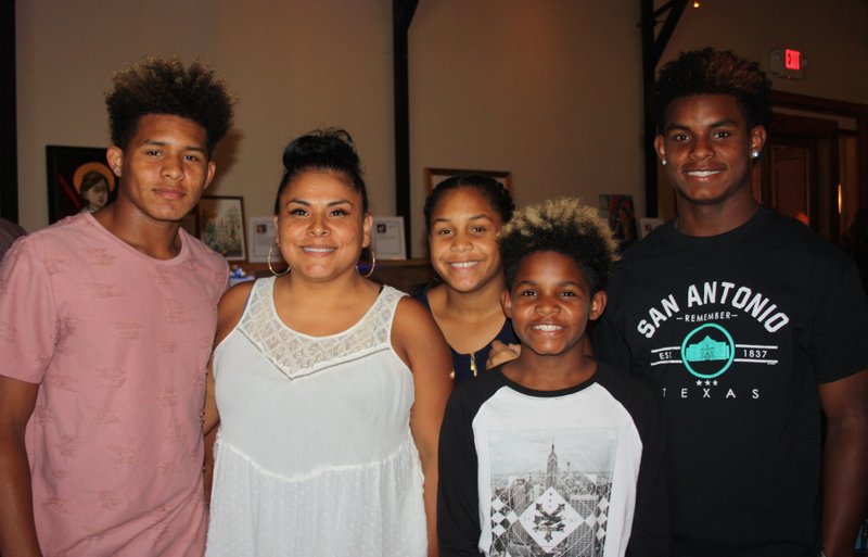 Amelia Bautista (second from left) is joined by her children, Bryndell Cook (from left), Byanca Cook, Bliyge Cook and Bryton Cook, on Aug. 11 at Heels and Hammers in support of Habitat for Humanity of Washington County's Women Build.