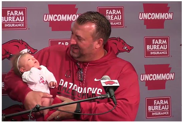 Arkansas football coach Bret Bielema brought his 1-month-old daughter, Briella, to a news conference in August to introduce her to the media. Arkansas coaches say new dad Bielema is walking on Cloud 9.