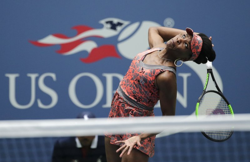Venus Williams, of the United States, serves to Viktoria Kuzmova, of Slovakia, during the first round of the U.S. Open tennis tournament, Monday, Aug. 28, 2017, in New York. (AP Photo/Seth Wenig)
