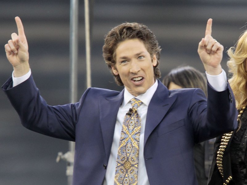 FILE - This April 24, 2010 file photo shows Lakewood Church pastor Joel Osteen at Dodger Stadium during his "A Night of Hope" in Los Angeles. Osteen said in a statement to ABC News on Aug. 28, 2017, that his Lakewood Church would open as a shelter for Hurricane Harvey victims if needed. (AP Photo/Richard Vogel, File)
