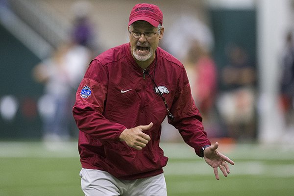 Arkansas defensive coordinator Paul Rhoads instructs players during practice Saturday, April 29, 2017, in Fayetteville. 
