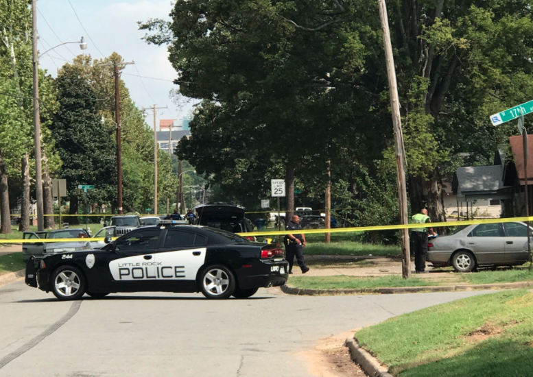 This Little Rock Police Department photo shows officers at the scene of a shooting near 16th and Elm streets on Tuesday.