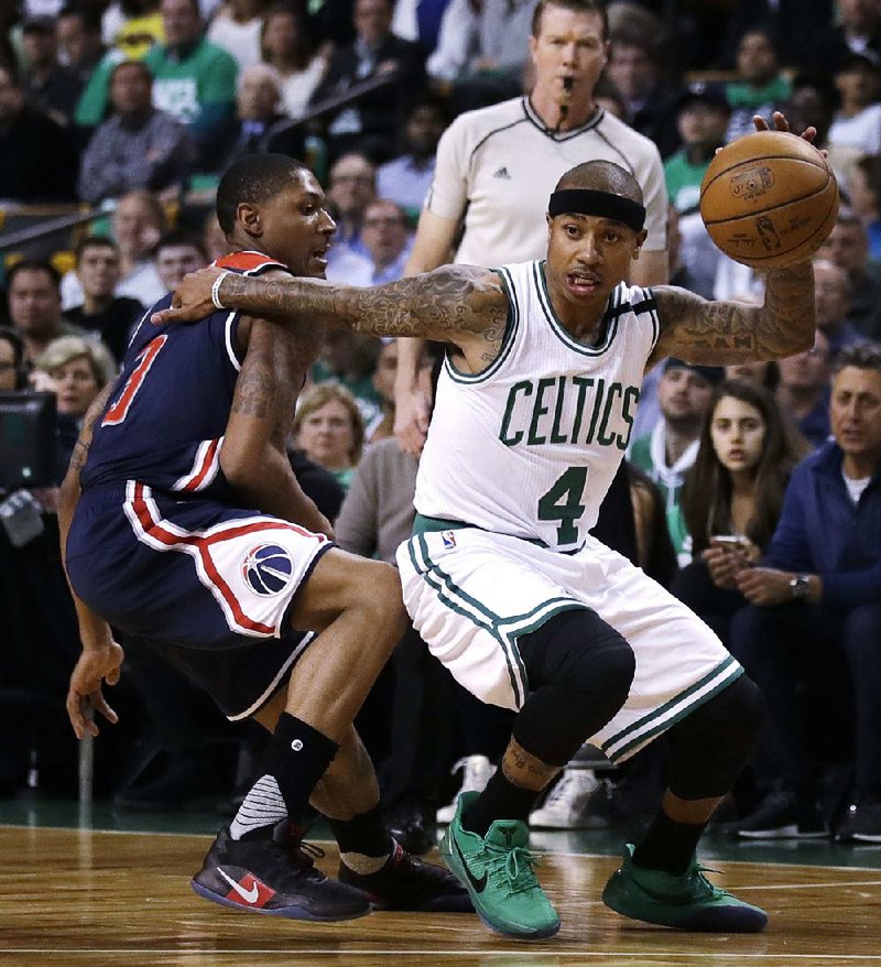 This file photo shows then Boston Celtics guard Isaiah Thomas (4) driving to the basket during the first quarter of a second-round NBA playoff series basketball game in Boston.  