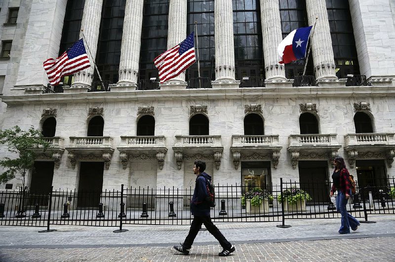 The Texas flag flies outside the New York Stock Exchange on Tuesday. The exchange has pledged more than $1 million for Hurricane Harvey relief efforts.