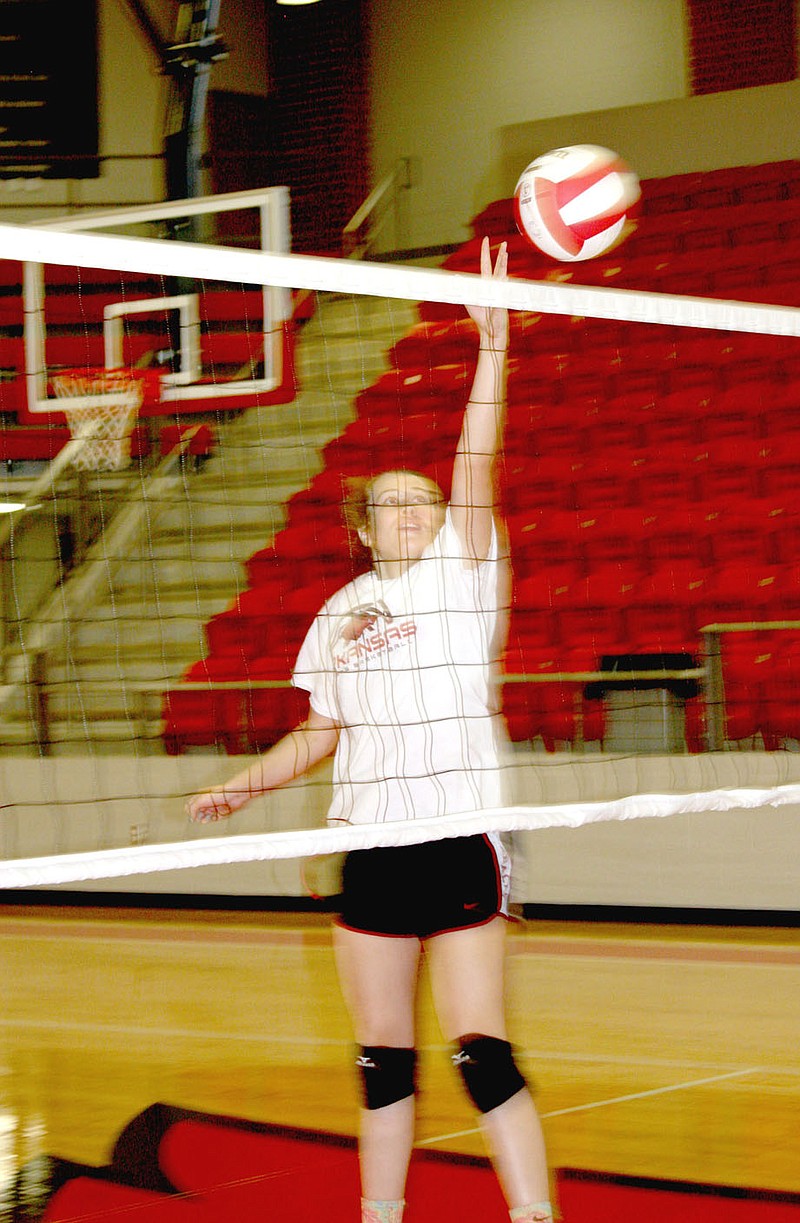 MARK HUMPHREY ENTERPRISE-LEADER Farmington senior Ella Wilson is the tallest Lady Cardinal on the varsity volleyball team at 5-feet-9. Rogers High defeated Farmington 3-0 in a nonconference volleyball match Aug. 22 on the Lady Mounties&#8217; home court at King Arena. Rogers won in three sets, 25-17, 25-14, 25-21.