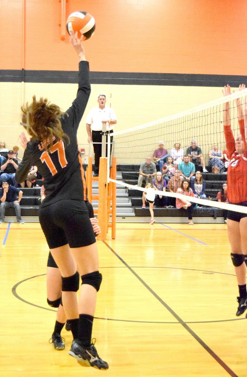 Photo by Mike Eckels Sally Bird (Gravette 17) used her fingertips to send the ball back to the Lady Cardinal court during the Gravette-Farmington volleyball match in the new gym at Gravette High School Aug. 24. The Lady Cardinals took the victory, 3 sets to 1, in the second conference contest of the 2017 season.