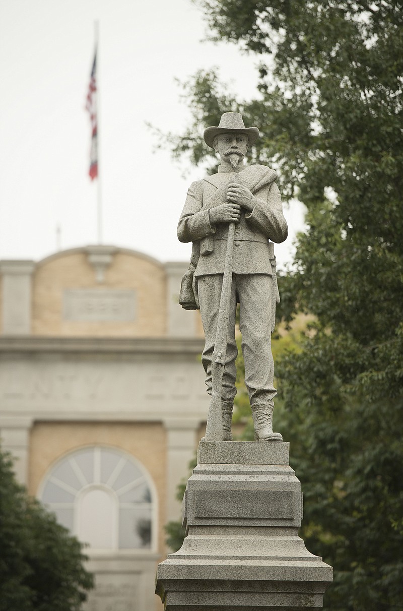 Staff photograph by Ben Goff A Confederate monument Monday, Aug. 14, 2017, at the center of the Bentonville square.