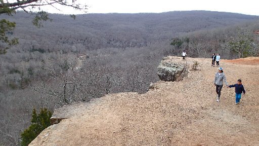 Visitors to the overlook along Yellow Rock Trail at Devil's Den State Park can number in the hundreds on weekends when the weather is pleasant. Hikers take in the view Jan. 1 2017 from the overlook.