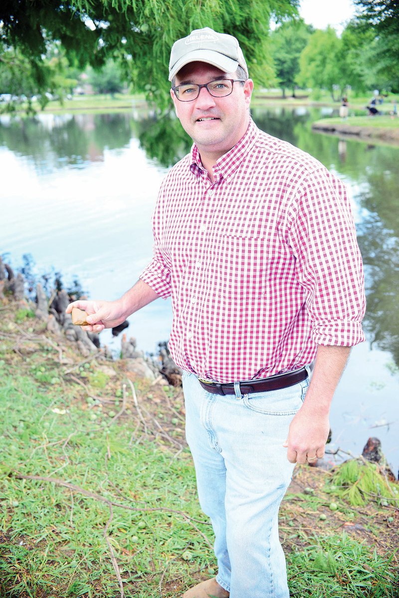 John Baker, a Little Rock attorney, holds a stone that he thinks is good for skipping. Baker, who grew up skipping rocks and enjoys the activity with his children, as well as his brother, created the Great Southern Stone-Skipping Championship. The second-annual event is scheduled for Saturday on Greers Ferry Lake in Fairfield Bay. Proceeds will go to three food pantries.