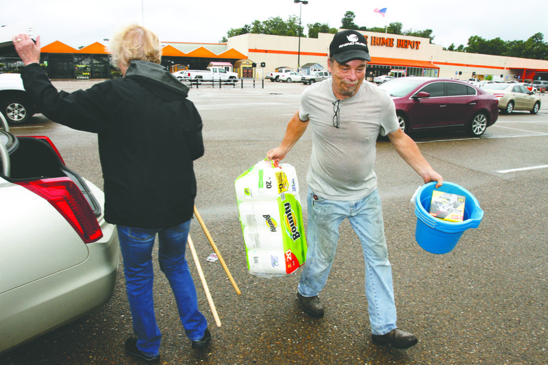 Donations: Kenny Dougan carries supplies from an anonymous donor. The supplies are for victims of Hurricane Harvey.