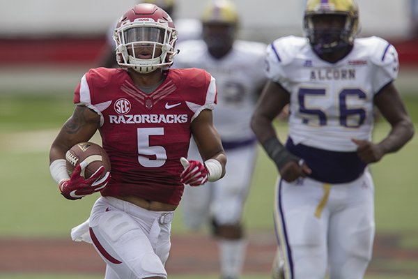Arkansas cornerback Henre Toliver returns an interception for a touchdown during a game against Alcorn State on Saturday, Oct. 1, 2016, in Little Rock. 