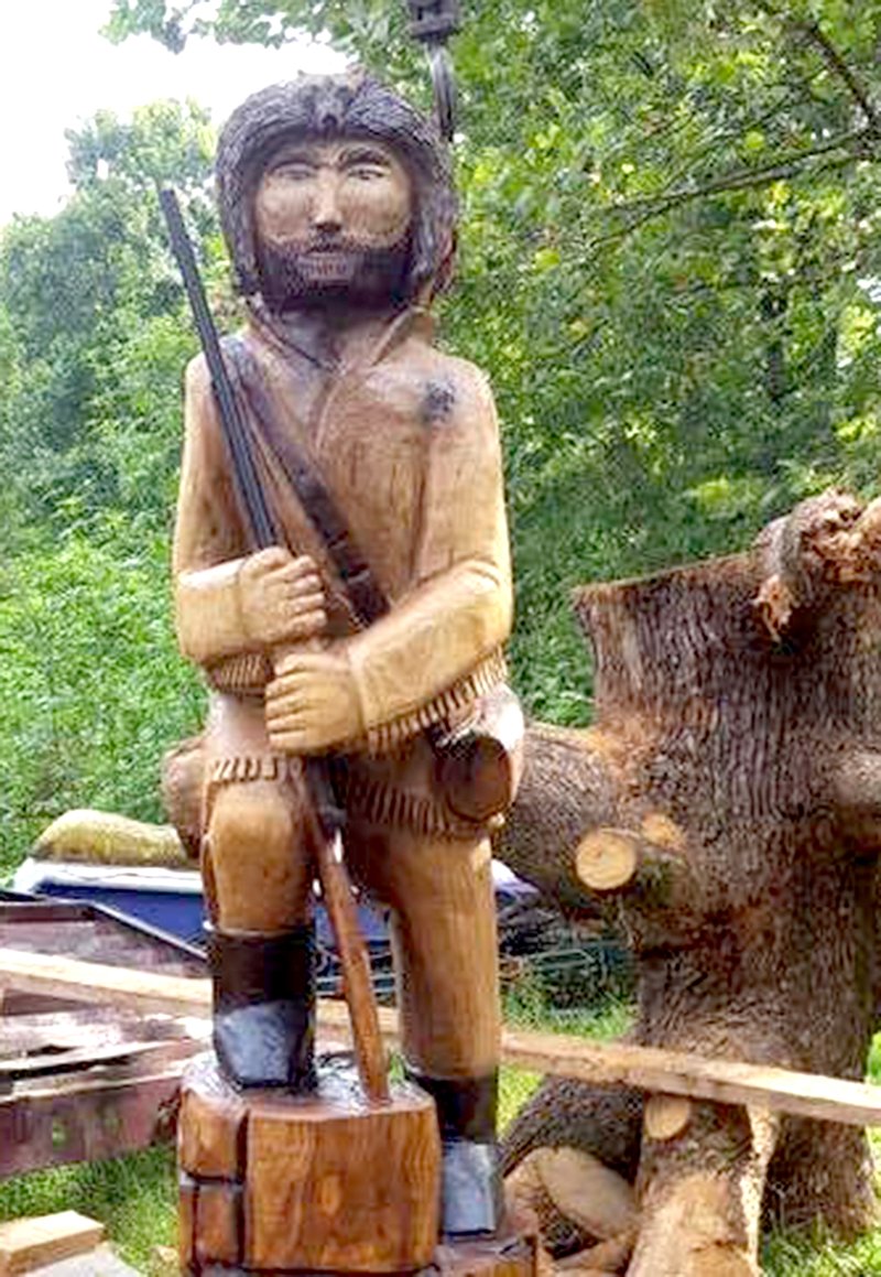 What was once the old "Smoking Tree" was saved from demolition and transformed into "Ole Smokey," a replica of the Gentry Pioneer mascot. The chainsaw sculpture will soon be displayed on the high school campus.