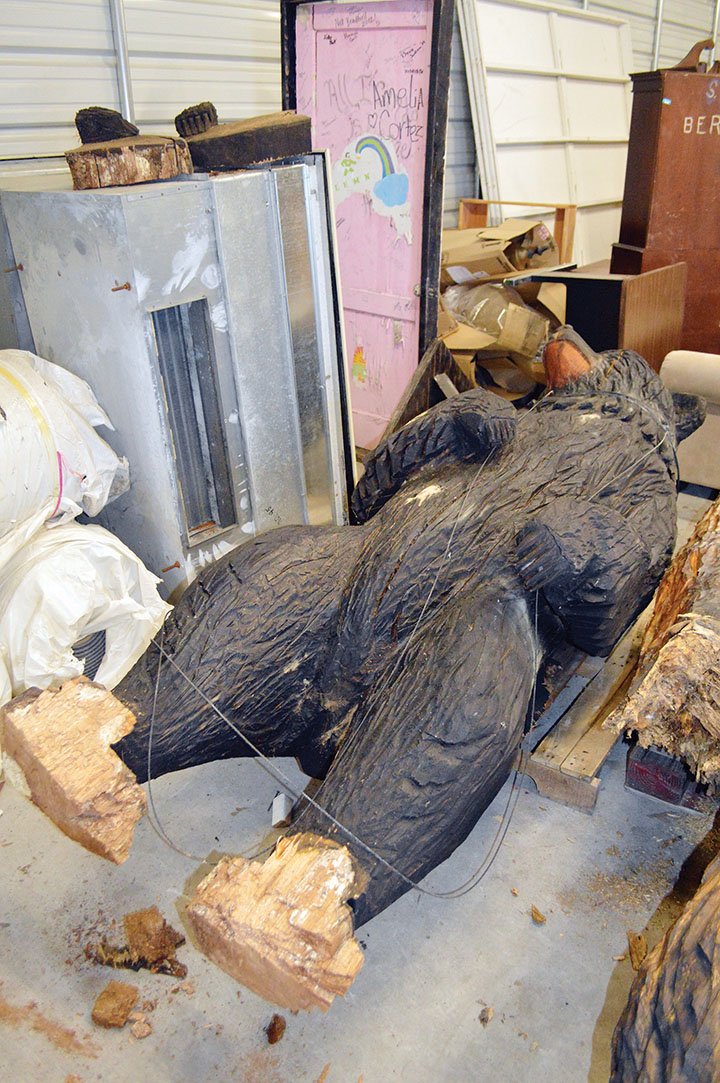 Valor the bear hibernates in a storage building at the University of Central Arkansas. Two of his paws, shown at left, were removed after being damaged by termites and water. His torso also has a crack. Larry Lawrence, director of the UCA Physical Plant, said the carved bear was treated for termites and sealed repeatedly. A structural engineer has been consulted about how to repair the bear before he is placed back on his concrete base in front of Wingo Hall, which Lawrence said he estimates will be late September or early October.