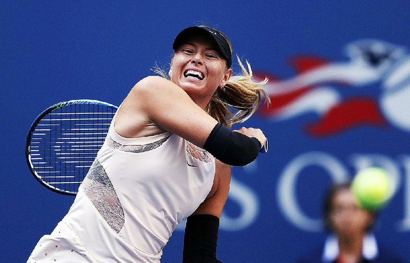 Maria Sharapova returns a shot from Timea Babos during the second round of the U.S. Open on Wednesday in New York. 