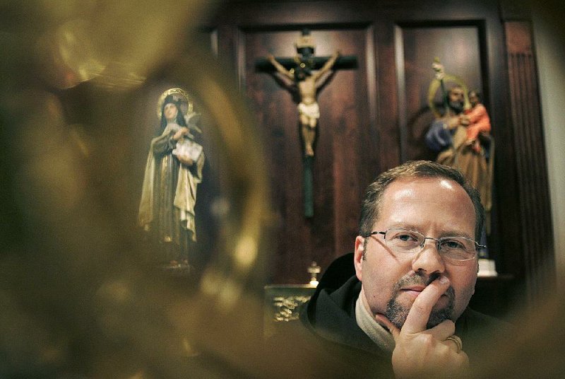 Dennis Wyrzykowski of Carmel Laboratories LLC poses in a chapel at a Carmelite monastery in Millbury, Mass., in 2009. Wyrzykowski has sued L’Oreal, accusing the company of stealing patented technology in a wrinkle cream. 