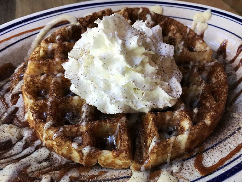 The Churros Waffle comes loaded with sugary goodness — topped with cinnamon, caramel and Creme Anglaise — for brunch at Heights Taco & Tamale. 