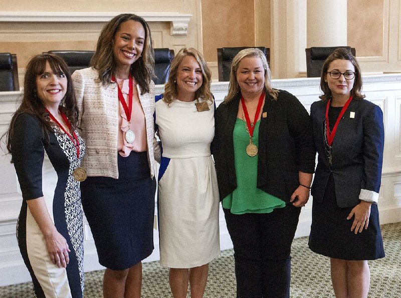 Courtney Cochran, (center), the 2017 Arkansas Teacher of the Year, stands with this year’s four semi-finalists for the 2018 award during an Arkansas Department of Education recognition event Wednesday at the state Capitol. They are (from left), Amanda Jones of Poyen High School; Tasha Shoate of Cavanaugh Elementary School in Fort Smith; Cochran; Randi House of Theodore Jones Elementary School in Conway, and Brittany Berry of Helen Tyson Middle School in Springdale.