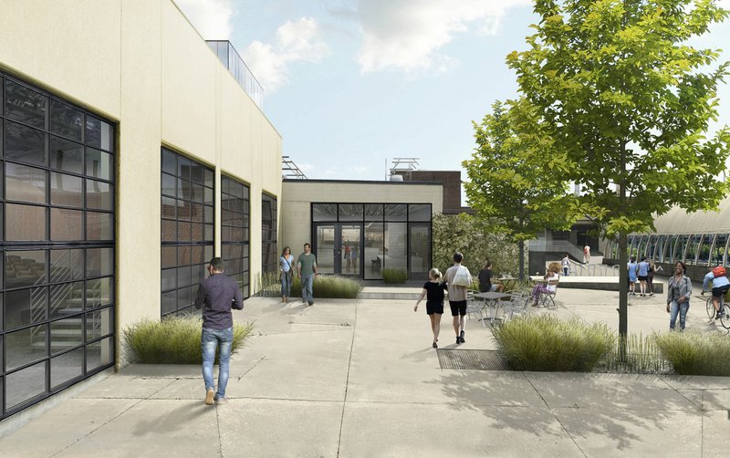 This artist’s conception shows the Momentary’s East-facing storefront that opens to the large green space in Bentonville. An open courtyard surrounds the building.