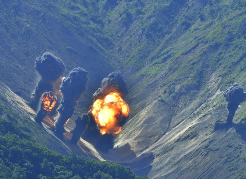 In this photo provided by South Korea Defense Ministry, bombs dropped by U.S. Air Force B-1B bombers, F-35 stealth fighter jets and South Korean F-15 fighter jets hit a simulated target as they fly over the Korean Peninsula, South Korea, on Thursday, Aug. 31, 2017. 