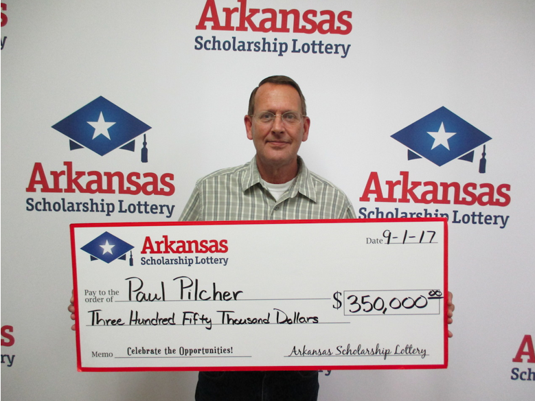 Paul Pilcher collected his prize Friday, after buying a winning lottery ticket at a Shell gas station.