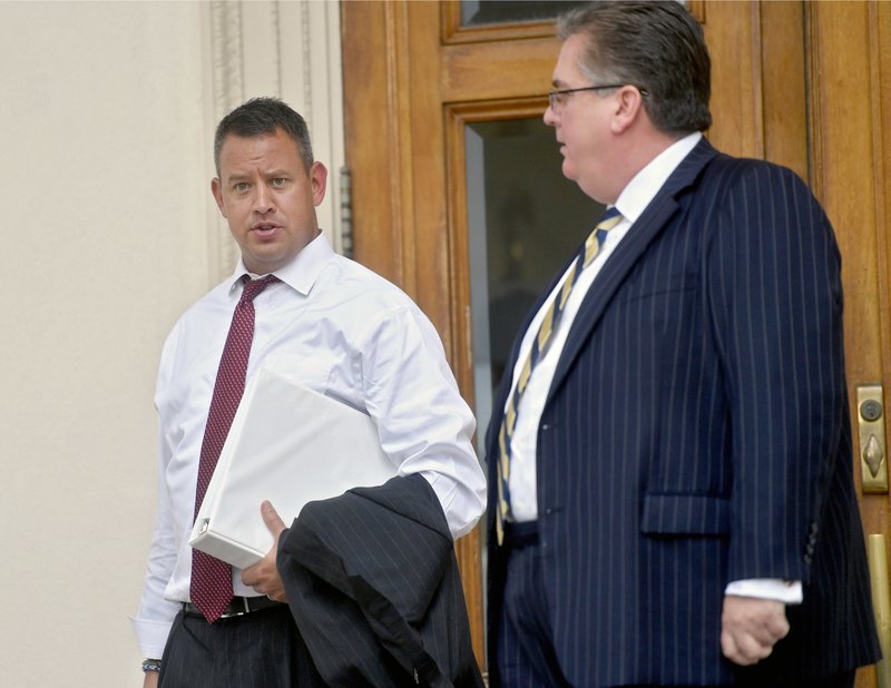 Attorney Jason Dunkle, representing Ryan McCann and Lucas Rockwell walks out of the Centre County Courthouse after closing arguments for the brothers of Beta Theta Pi charged in the death of Timothy Piazza, Thursday, Aug. 31, 2017 in Bellefonte, Pa. A Pennsylvania judge says he'll rule Friday morning on whether there's enough evidence against Penn State fraternity brothers in the death of a pledge to send the case to trial. 