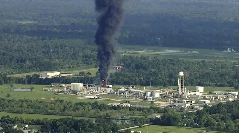 A plume of smoke rises at the Arkema chemical plant in Crosby, Texas, on Friday after two trailers of unstable compounds exploded, the second fire at the plant in two days.