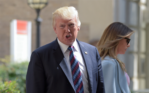President Donald Trump, with first lady Melania Trump with him, responds, "We'll see," as he is asked a question about attacking North Korea after the Trump's attended services at St. John's Church in Washington, Sunday, Sept. 3, 2017. 