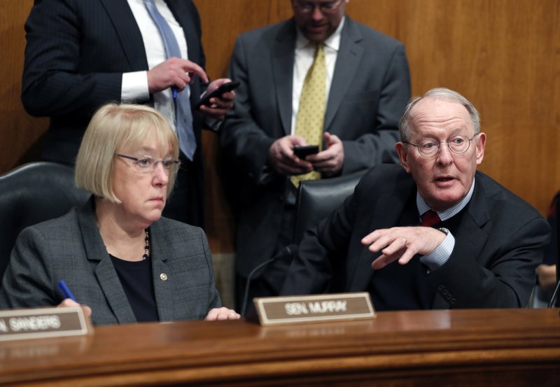 FILE - In this Jan. 31, 2017 file photo, Senate Health, Education, Labor, and Pensions Committee Chairman Sen. Lamar Alexander, R-Tenn., accompanied by the committee's ranking member Sen. Patty Murray, D-Wash. speaks on Capitol Hill in Washington. 